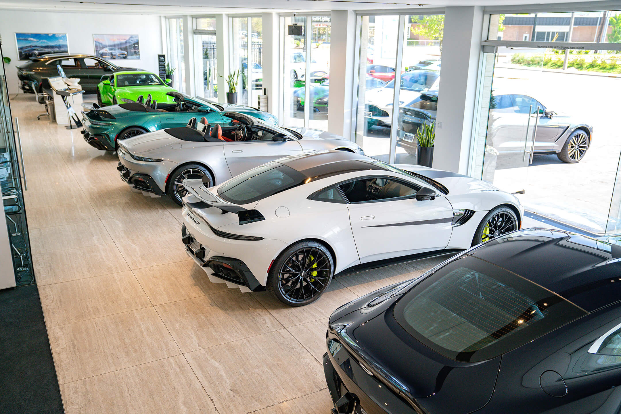 A line of cars inside a dealership
