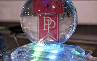 Glass ball with Park Place Logo behind it